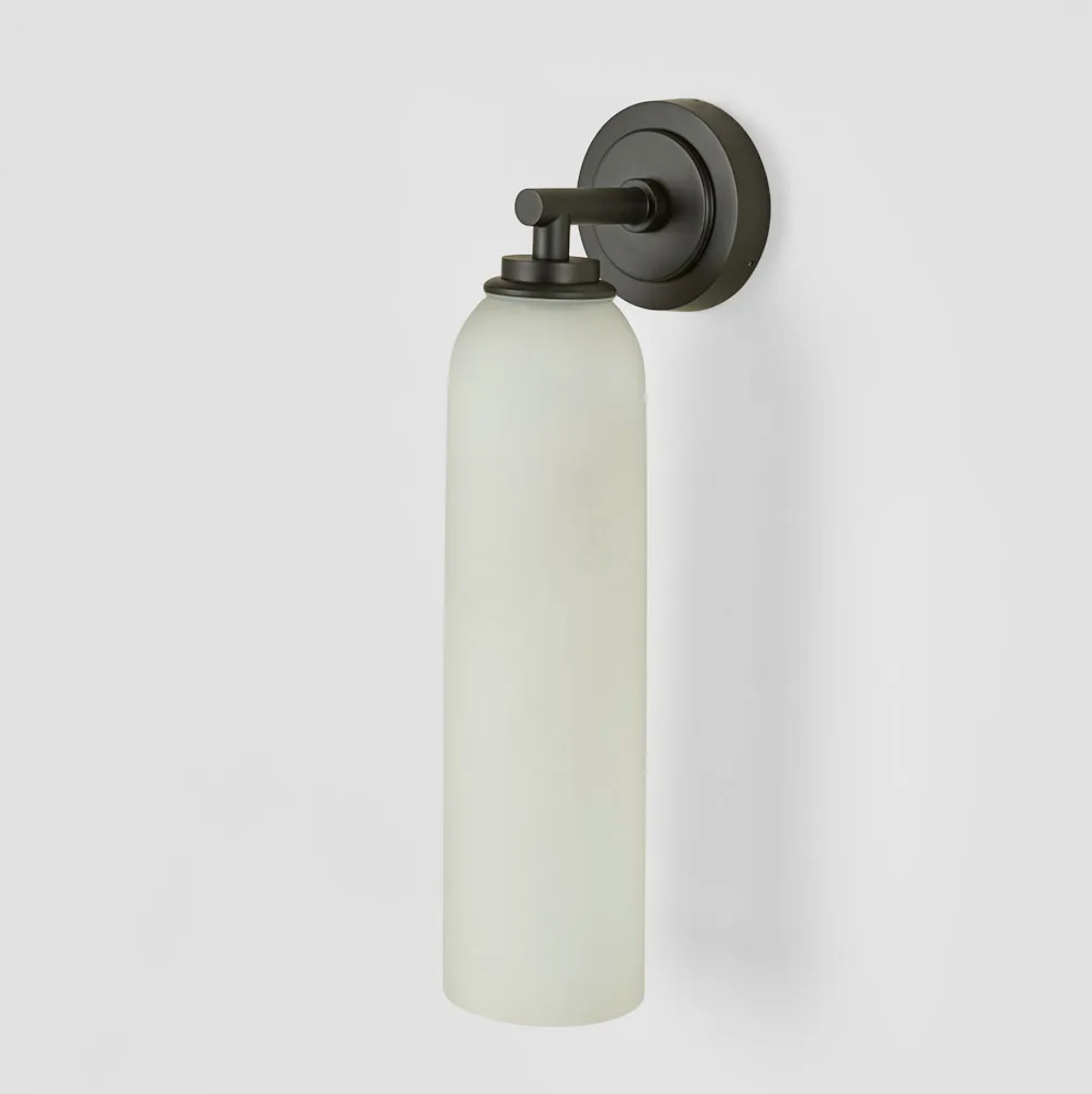 Wall-mounted light fixture with frosted glass shade on a white background