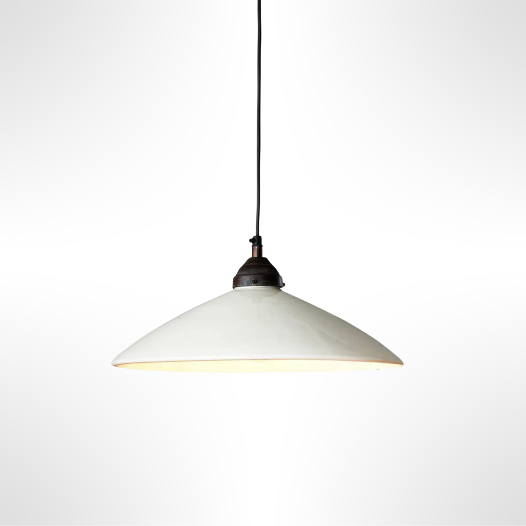 Pendant light with white shade and bronze fixture on a white background