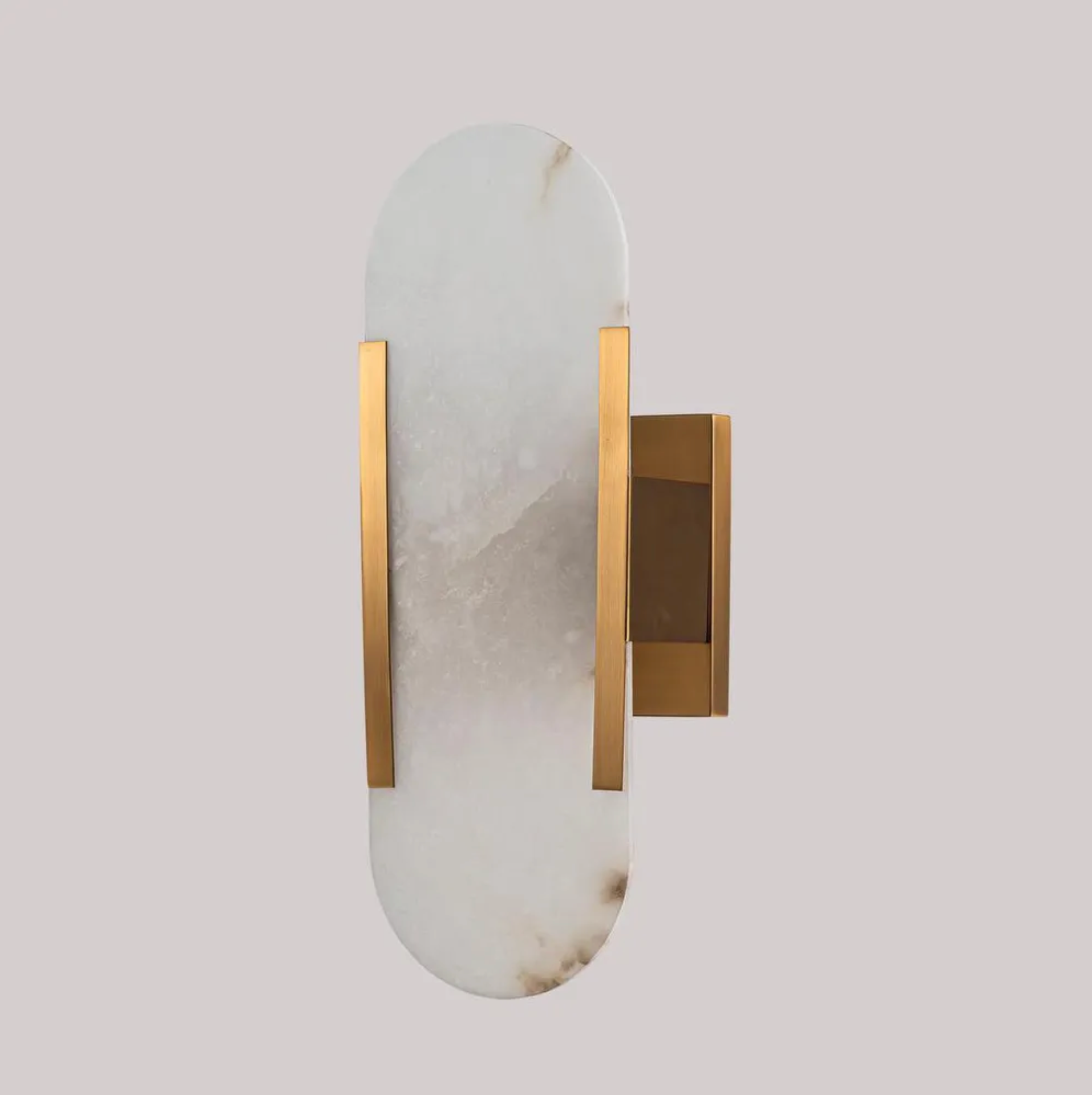 Decorative wall sconce with marble and gold finish on a light gray background