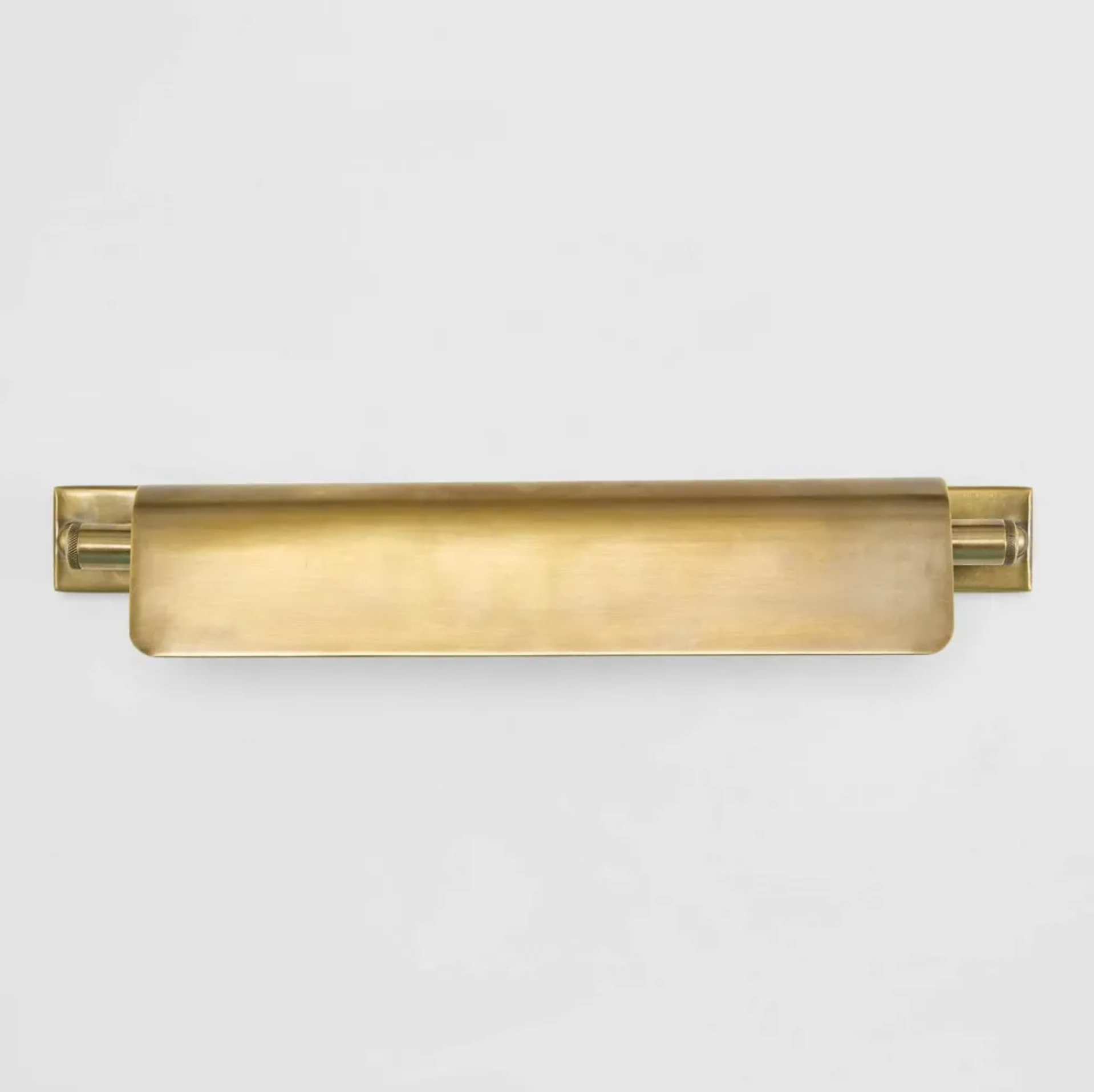 Gold picture light on a white background