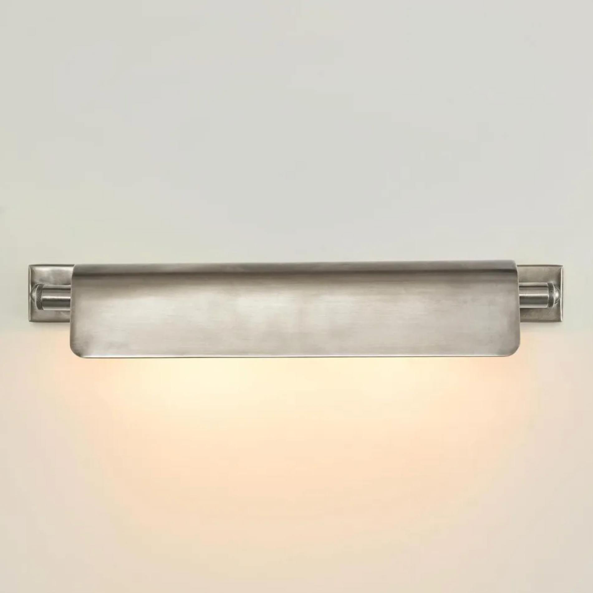 Modern antique silver wall-mounted light fixture on a neutral background