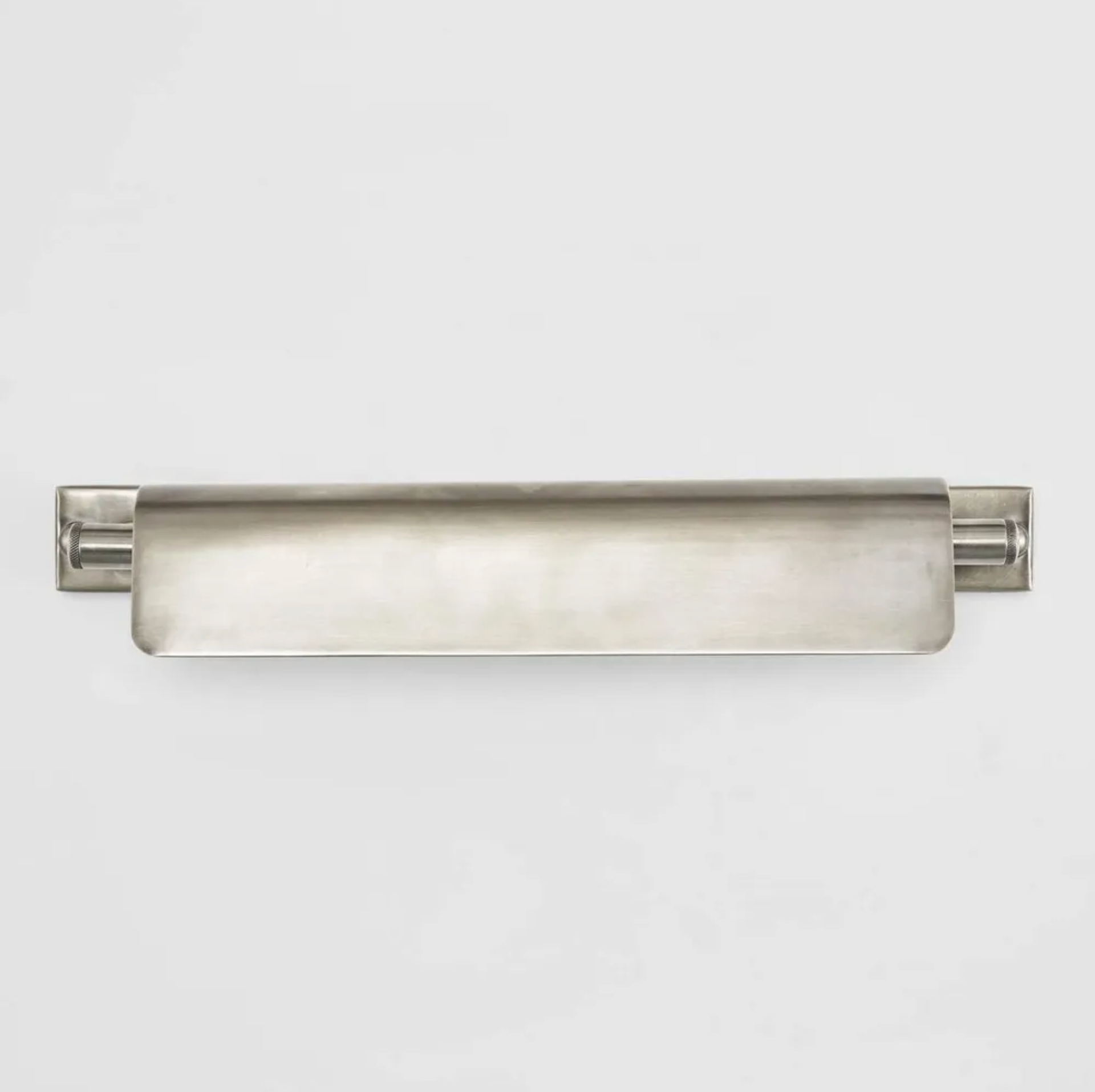 Modern wall-mounted light fixture on a white background