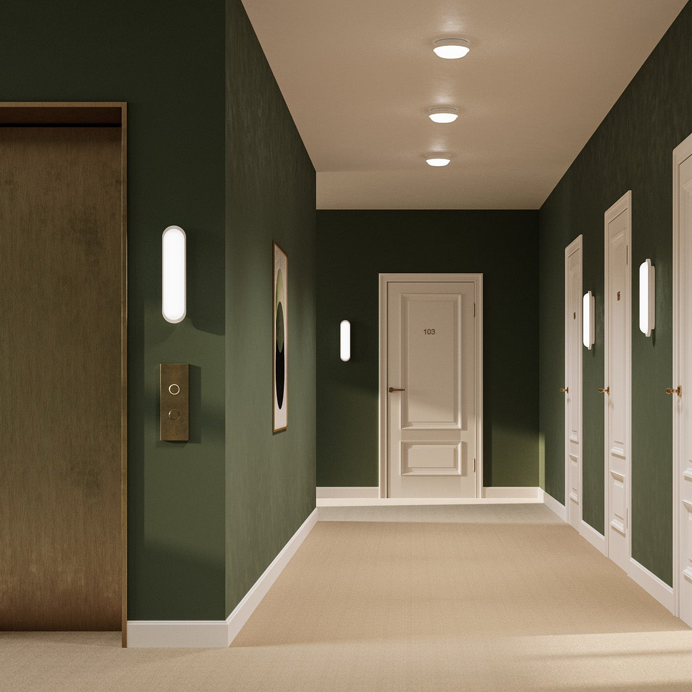 Modern hallway with green walls, beige carpet, and recessed ceiling lights.