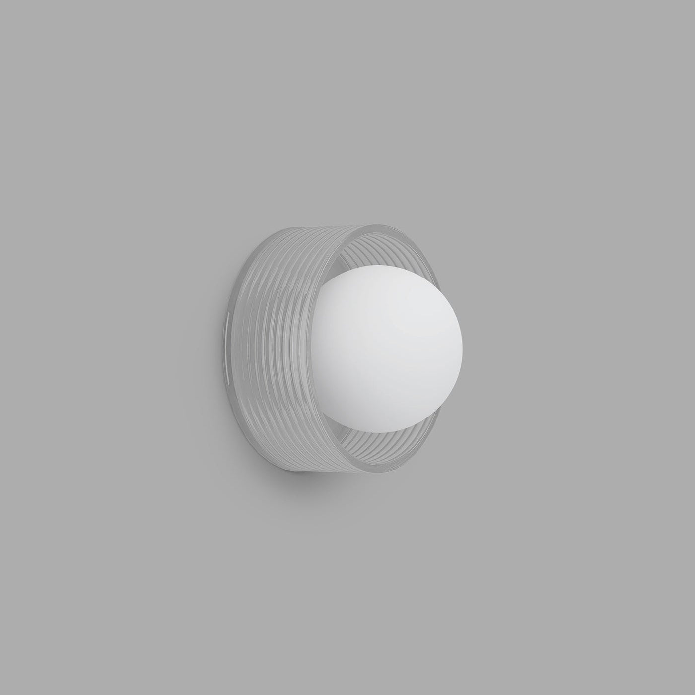 Wall-mounted light fixture with a white bulb on a gray background
