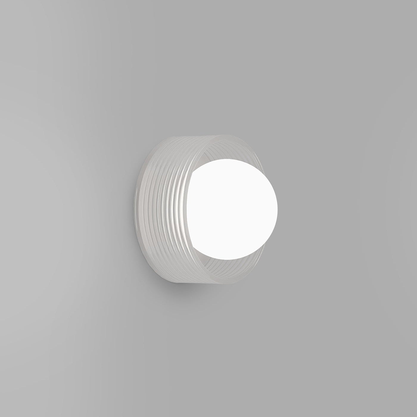 Round white light fixture on a gray background