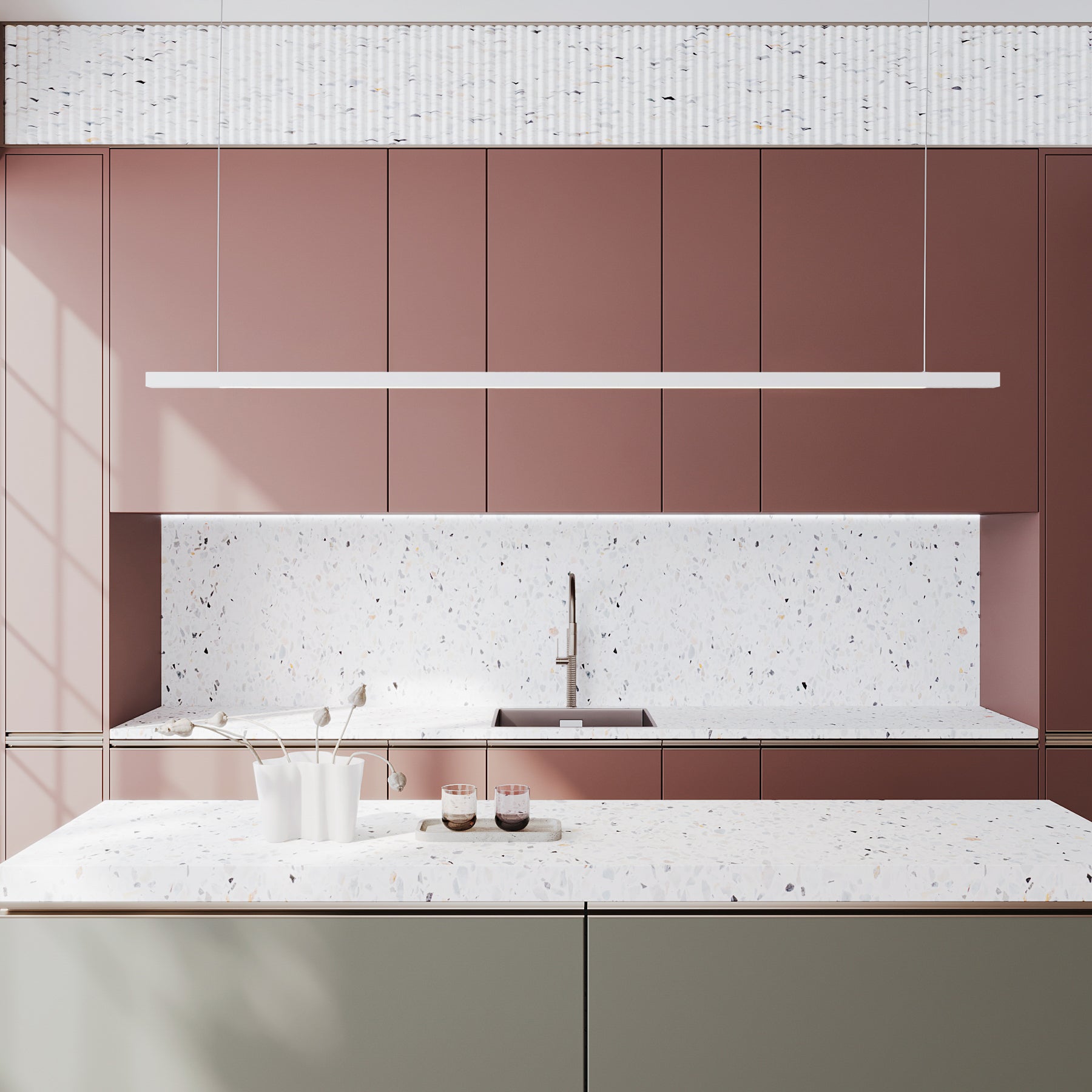 A modern kitchen interior with a white pendant LED light fixture suspended above the countertop, featuring a minimalist design with potential uplighting and downlighting options.