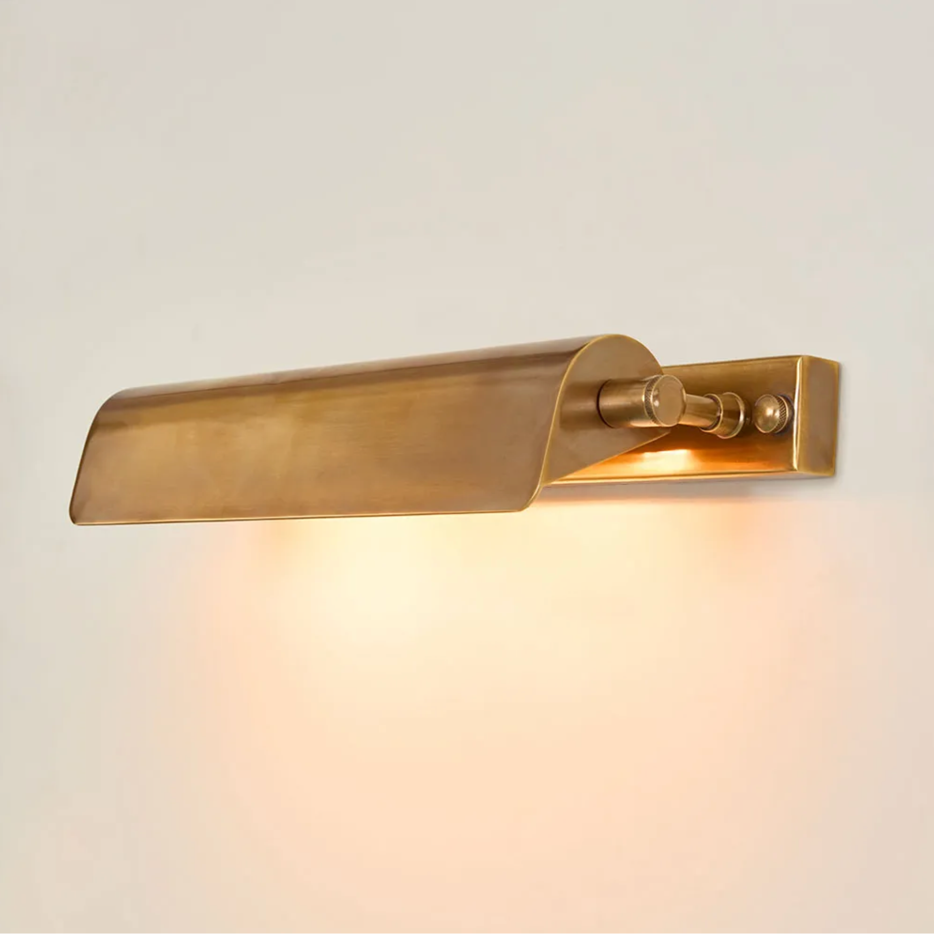 Brass picture light on a light gray background