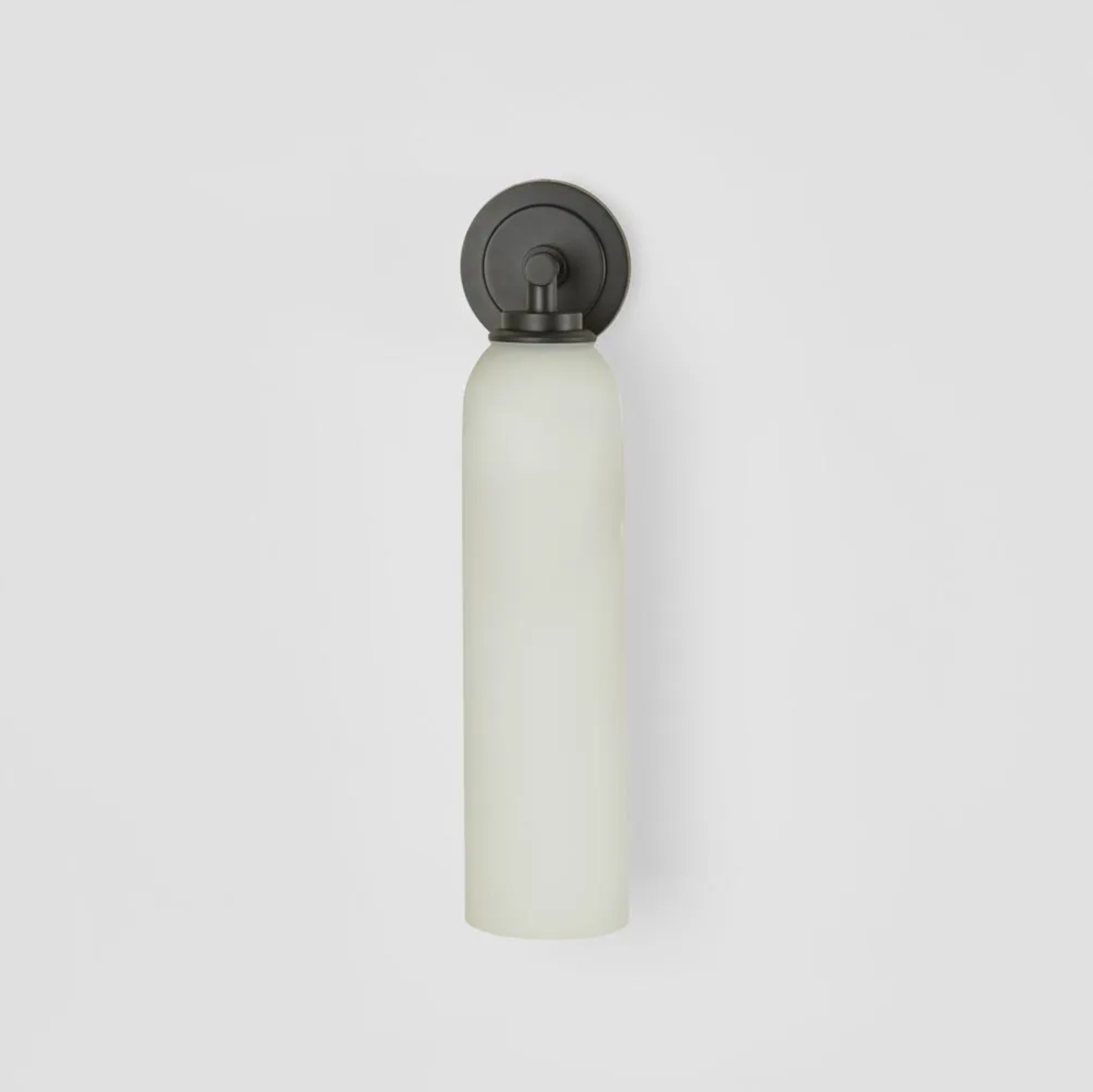 White cylindrical light fixture with black fixture on a white background