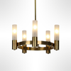 Brass chandelier with glass shades on a white background
