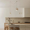 Modern kitchen with wooden stools and pendant lights