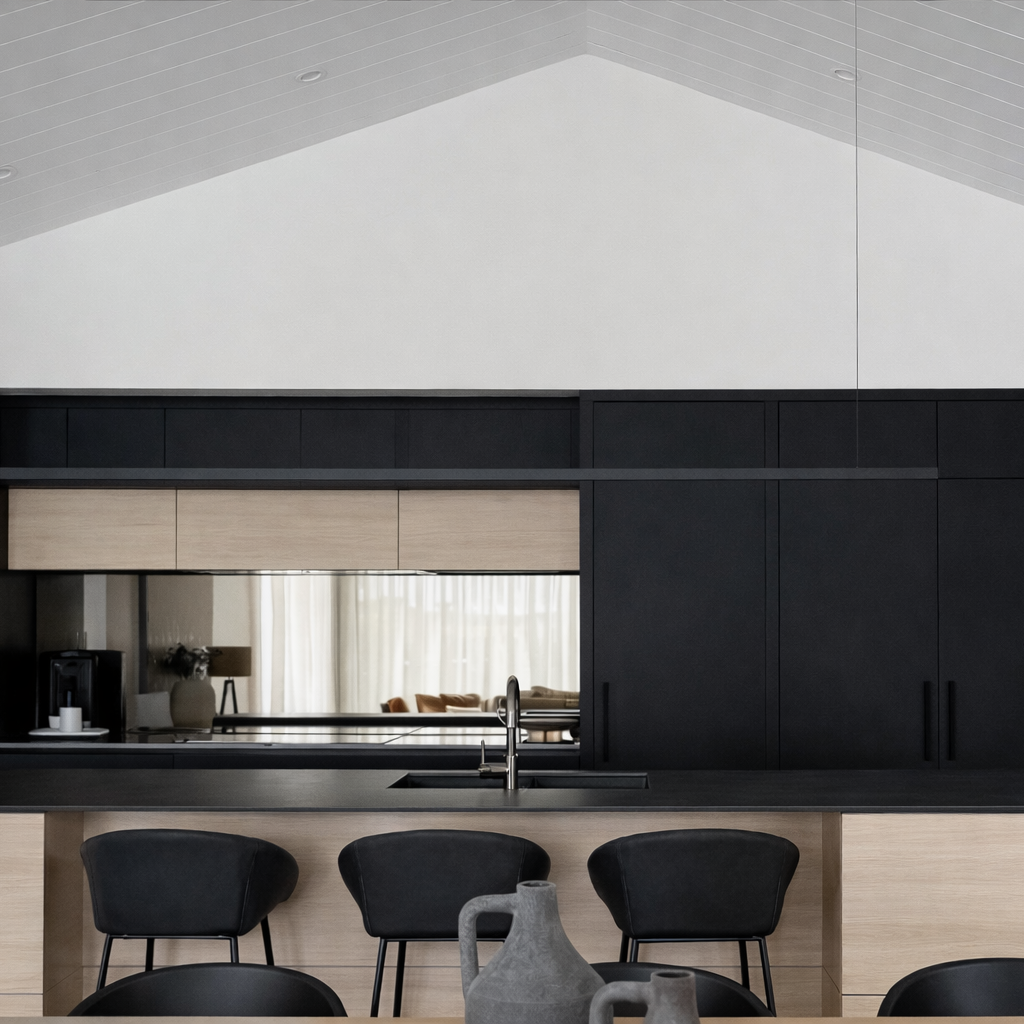 Modern kitchen with black linear light and and black wood design, featuring a island and chairs.