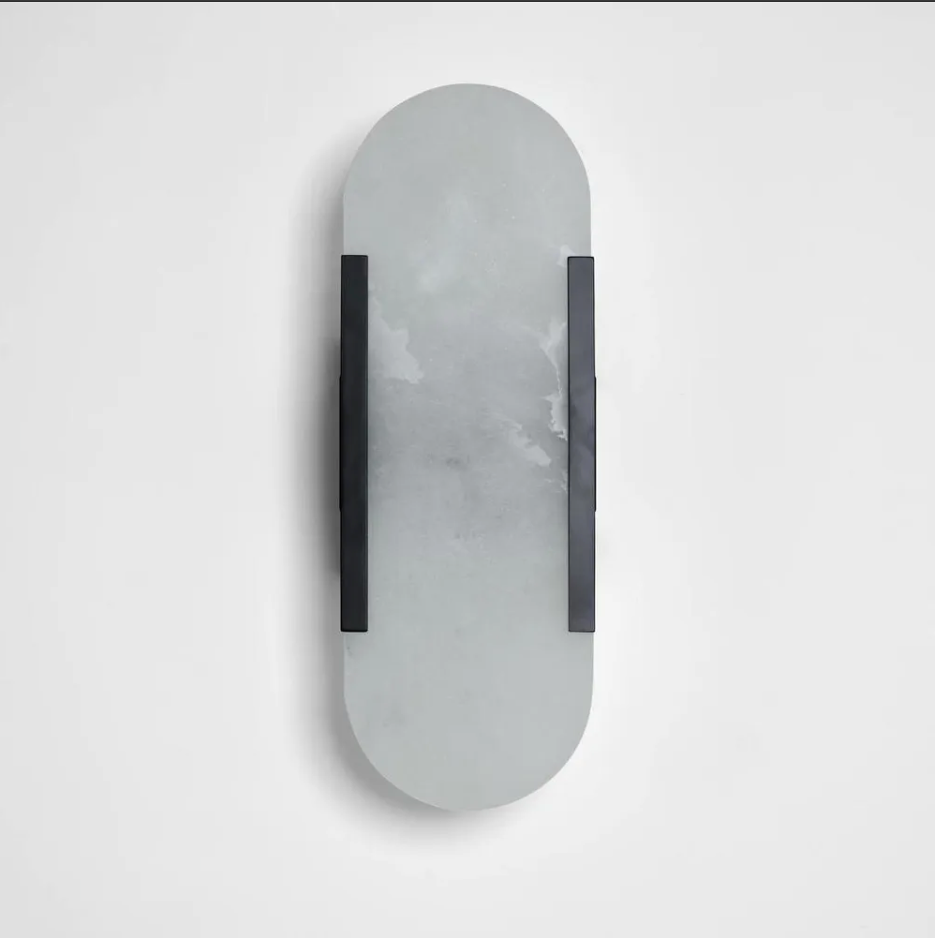 Wall-mounted mirror with a gray marble-like finish and black frame on a light gray background
