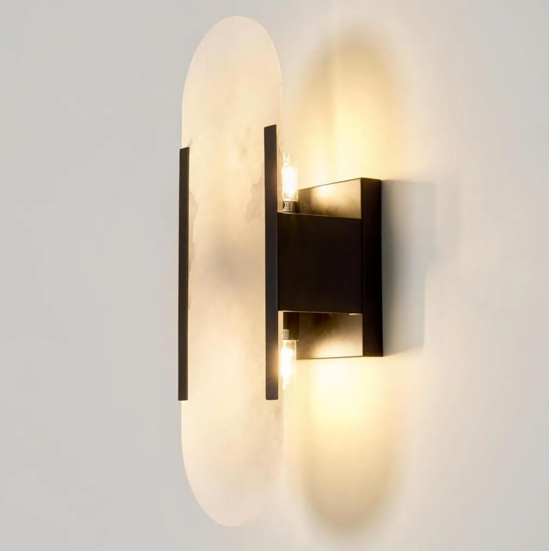 Modern wall-mounted light fixture on a plain background