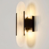 Modern wall-mounted light fixture on a plain background